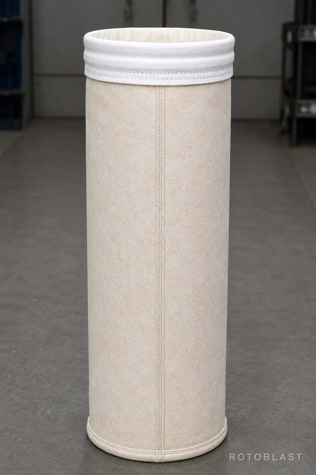 Dust collector filter bag for a shot blasting machine extraction system